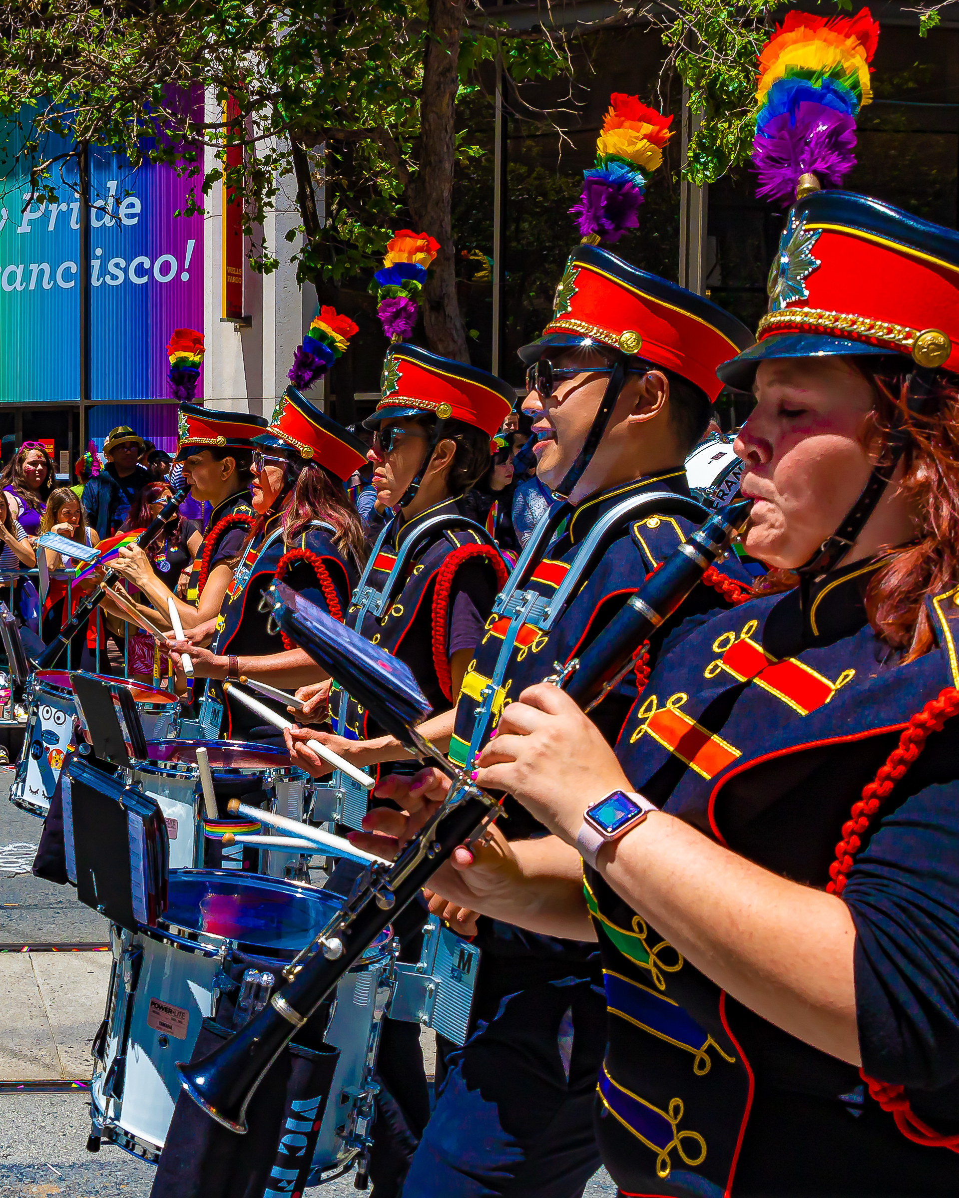 SF Pride marching band — rainbow flags waving along the route